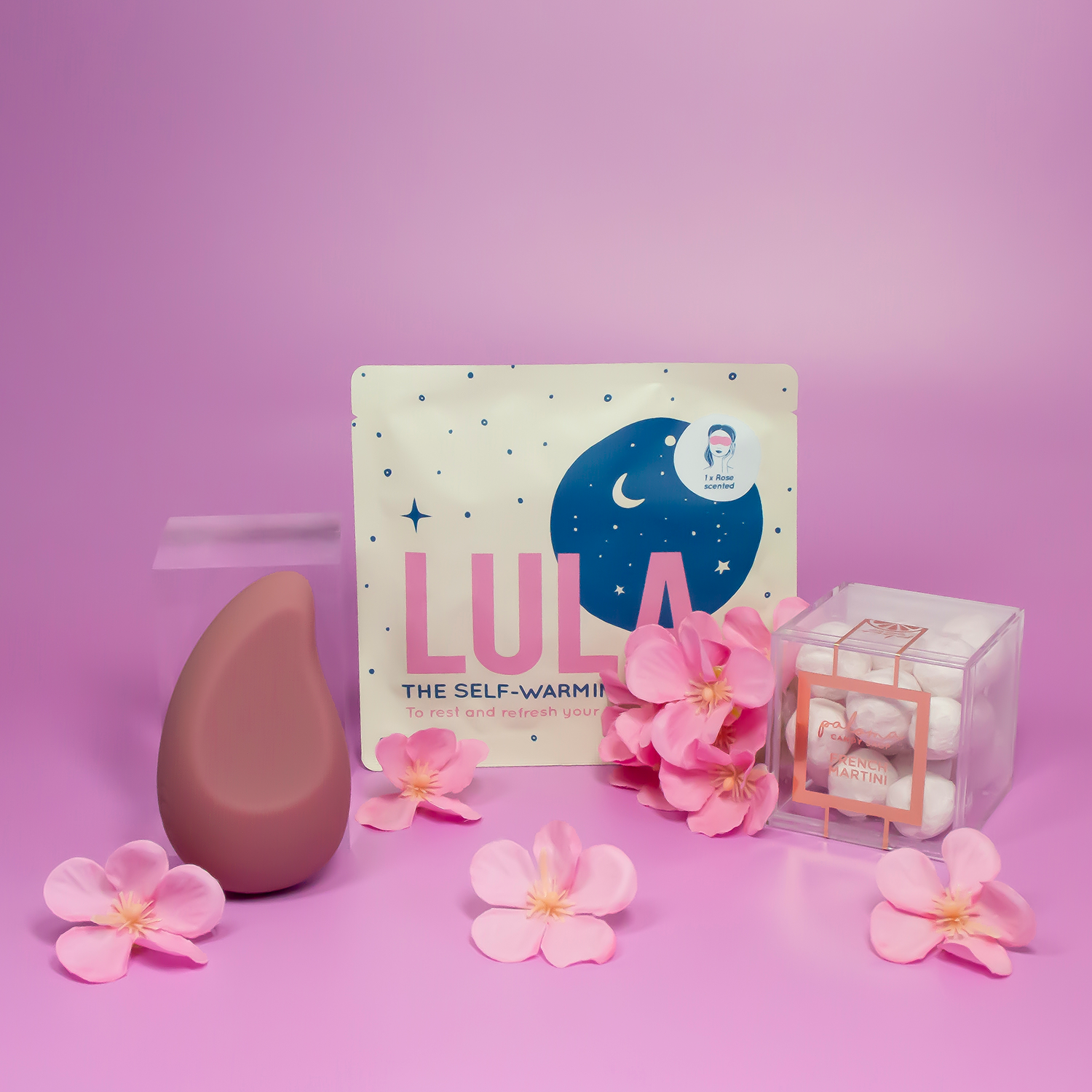 Pink palm vibrator, LULA Rose eye mask and candy cube gift box.