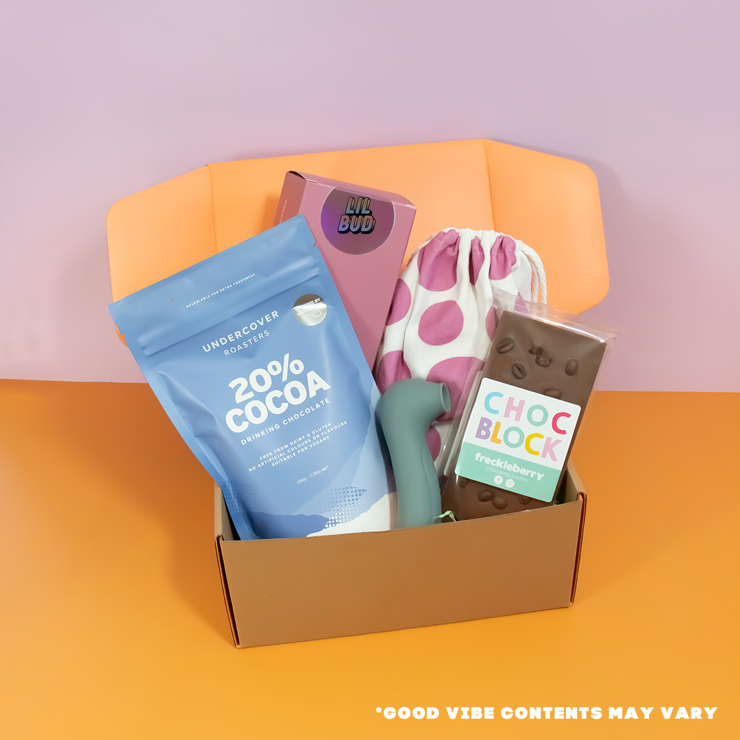 Sex toy subscription box with chocolate, vibrator and hot chocolate.